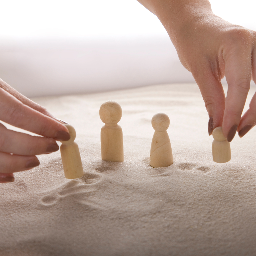 Figurine board representing Family Constellations therapy session
