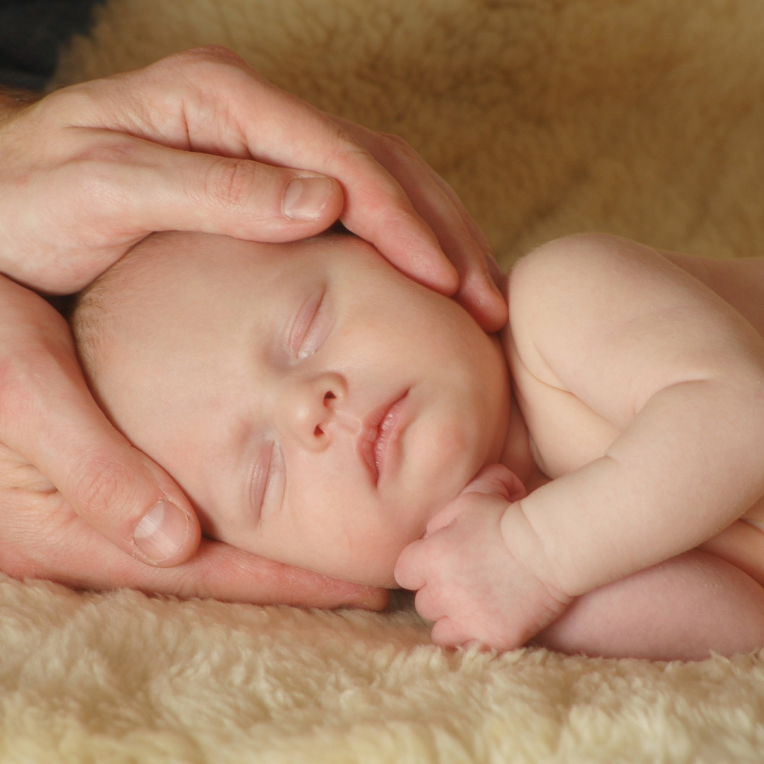 Newborn receiving Reiki energy healing session