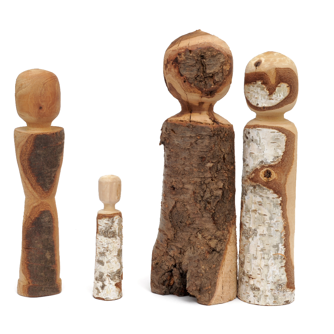 Wooden figurines arranged in a circle representing family members in a Family Constellations session.